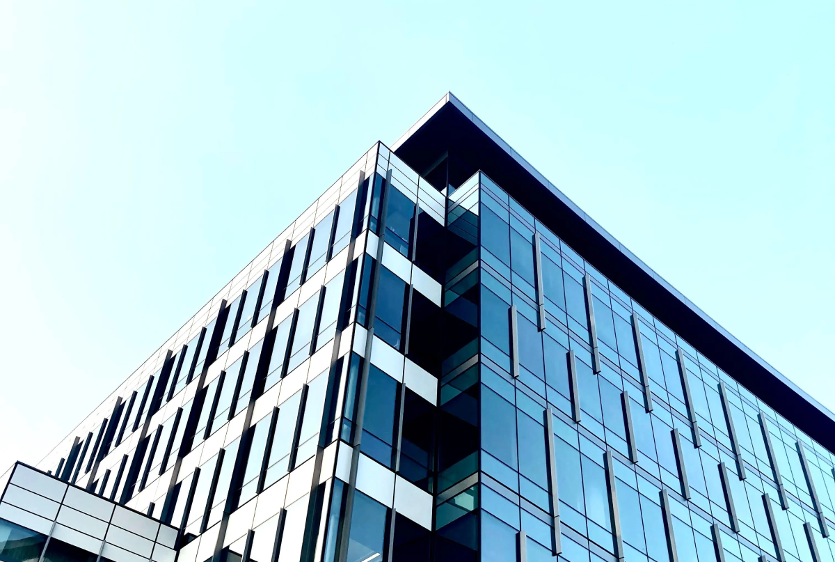 Sleek skyscraper against blue sky